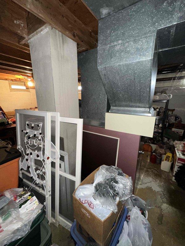 Completed comprehensive HVAC system evaluation in residential basement utility area for full equipment replacement estimate. Assessed existing furnace and air handler configuration, documented current electrical panel capacity and conduit routing, evaluated ductwork connections and plenum mounting, and photographed equipment layout to provide detailed replacement recommendations and specifications for new high-efficiency heating and cooling system installation.