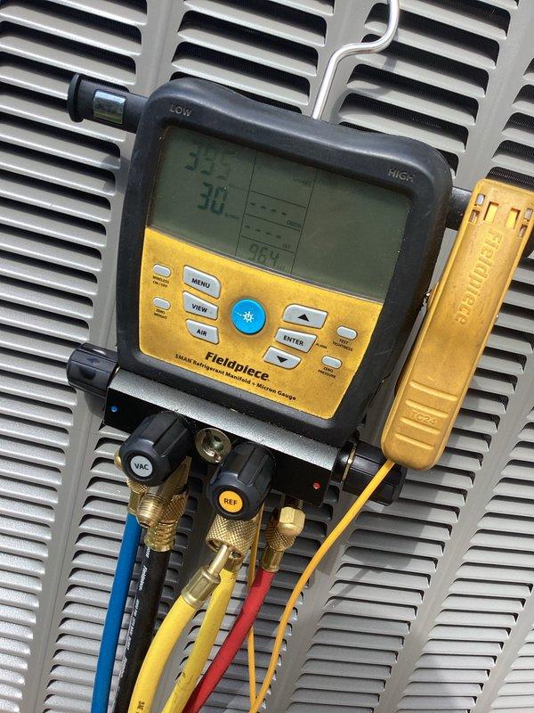 # HVAC Install - A/C & Coil

Completed installation of new air conditioning system including outdoor condensing unit and indoor evaporator coil. Positioned condenser unit on concrete pad adjacent to structure with proper clearances maintained. Mounted electrical disconnect box on exterior wall per code requirements. Connected refrigerant lines using industry-standard brazing techniques and pressure-tested system for leaks.

Charged system with appropriate refrigerant type and quantity per manufacturer specifications. Utilized Fieldpiece manifold gauge system to verify proper system pressures and temperatures during startup. Measured supply air temperature at 35°F and return air temperature at 30°F, confirming adequate cooling performance. Conducted operational testing of compressor, condenser fan motor, and evaporator blower to ensure all components functioning correctly.

Verified electrical connections at disconnect box and condensing unit. Confirmed proper amperage draw on all motor