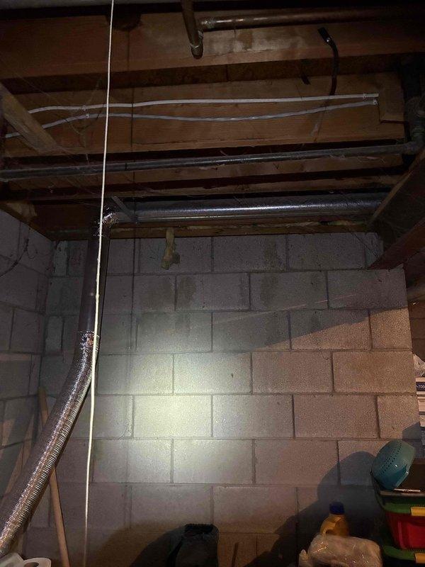 Completed furnace inspection and system evaluation in residential basement mechanical area. Documented existing HVAC infrastructure including ductwork routing, supply and return air distribution systems, and equipment accessibility. Verified proper clearances around heating equipment and assessed overall mechanical room conditions. Insulated ductwork and copper plumbing lines were observed in good condition with appropriate mounting and support throughout the ceiling joists. All utility connections and structural installations were found to be properly secured and functioning as designed.