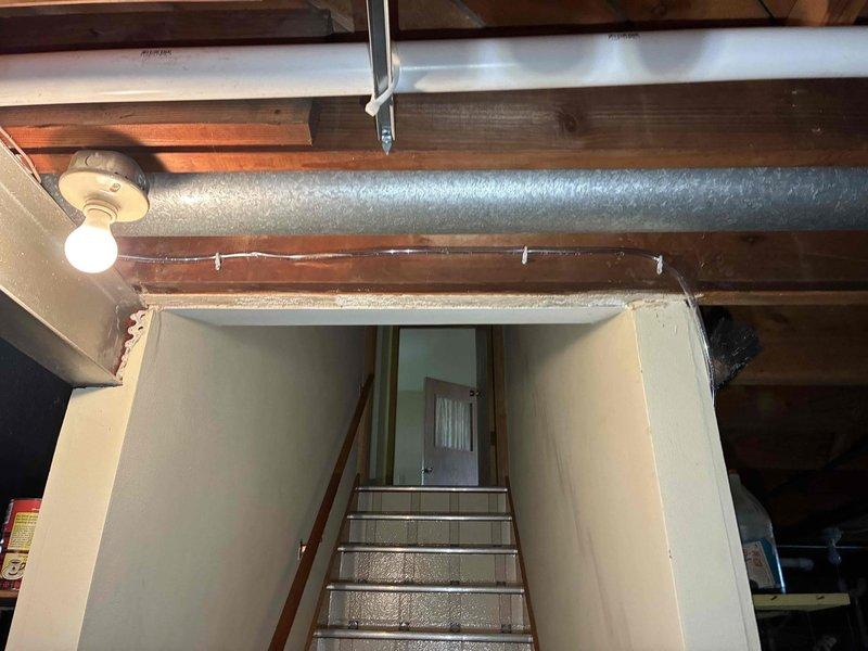 Completed HVAC system installation and performed initial start-up procedures in residential basement location. Installed new ductwork with reflective insulation running parallel to existing floor joists, ensuring proper airflow distribution throughout the structure. System was energized, tested for proper operation, and all components verified to be functioning within manufacturer specifications.