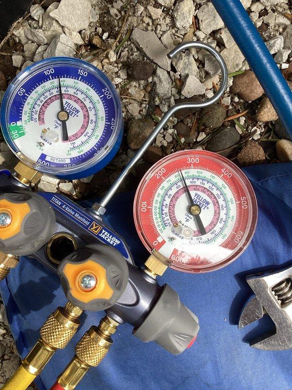 Completed system start-up and commissioning of newly installed HVAC equipment. Verified proper system operation using manifold gauge set to check refrigerant pressures and confirm system was within manufacturer specifications. Measured supply air temperature with digital thermometer, recording 84.9°F, and confirmed adequate temperature differential across the system. All equipment tested and operating as designed.