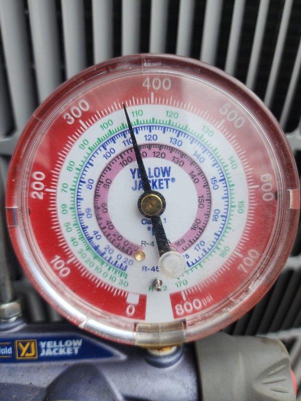 # HVAC Install - A/C & Coil

Completed installation of new outdoor air conditioning condenser unit and matching evaporator coil system. Unit was properly positioned on rubber isolation pad over concrete base with adequate clearance from structure and landscaping for optimal airflow and serviceability. All refrigerant lines were connected and system was charged to manufacturer specifications, as verified by manifold gauge readings showing proper operating pressures across multiple refrigerant scales. Electrical connections were completed per code requirements. System was tested for proper operation, with all safety controls and components functioning as designed. Installation site was left clean with unit secured and ready for service.