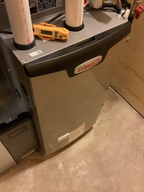 Completed system start-up and commissioning of newly installed Lennox furnace unit in residential basement location. Performed comprehensive electrical diagnostics using digital clamp meter and multimeter to verify proper voltage, amperage, and system operation across all circuits. Confirmed all electrical connections were secure, system controls functioning correctly, and unit operating within manufacturer specifications. Inspected evaporator coil condition and noted existing accumulation requiring future maintenance attention. System tested through full heating cycle with all safety controls verified operational.