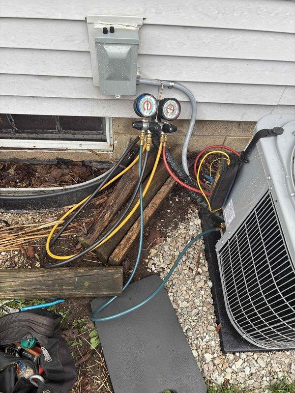 # HVAC System Installation and Start-Up

Completed installation and initial start-up of new HVAC system at residential property. Connected refrigerant manifold gauge set to system's service ports to verify proper refrigerant charge and system pressures. Monitored both high-side and low-side pressures during start-up sequence to ensure operation within manufacturer specifications. Verified all refrigerant line connections were secure and properly sealed. System started successfully with pressures reading within normal operating range. All electrical connections at outdoor disconnect verified and secured. Equipment left in proper operating condition with no leaks detected.