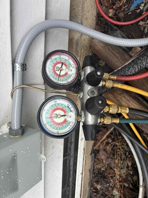 # HVAC System Installation and Start-Up

Completed installation and initial start-up of new HVAC system at residential property. Connected refrigerant manifold gauge set to system's service ports to verify proper refrigerant charge and system pressures. Monitored both high-side and low-side pressures during start-up sequence to ensure operation within manufacturer specifications. Verified all refrigerant line connections were secure and properly sealed. System started successfully with pressures reading within normal operating range. All electrical connections at outdoor disconnect verified and secured. Equipment left in proper operating condition with no leaks detected.