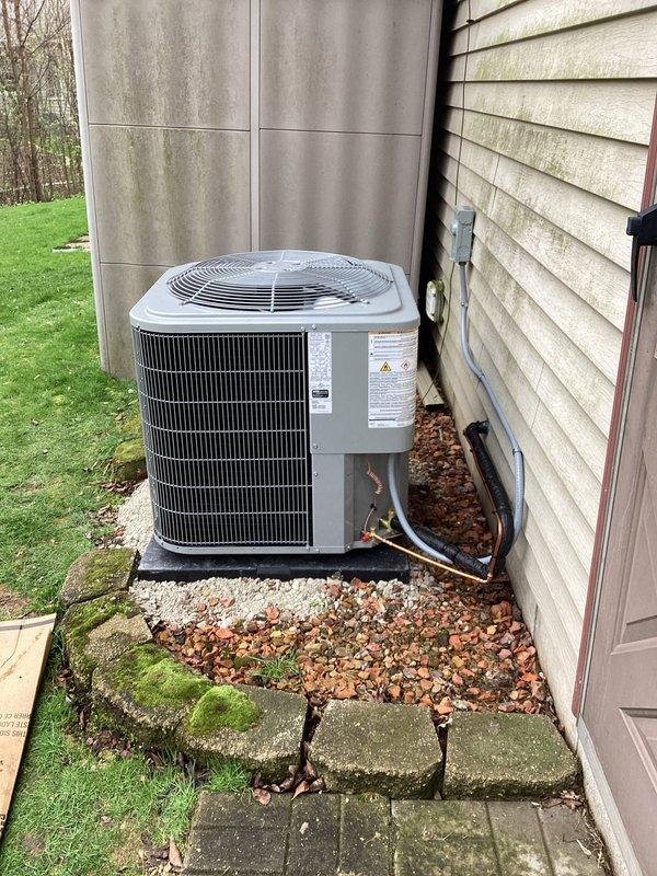 Completed full HVAC system installation including new outdoor condensing unit and indoor evaporator coil. Installed outdoor unit on reinforced platform against exterior wall with proper clearances, connected refrigerant lines with insulated linesets, and established electrical connections via dedicated conduit. Mounted new evaporator coil in basement mechanical area above existing laundry space, integrated with ductwork system, and completed all refrigerant piping connections. System was pressure tested, evacuated, and charged to manufacturer specifications. Verified proper airflow, temperature differential, and operational performance across all system components.