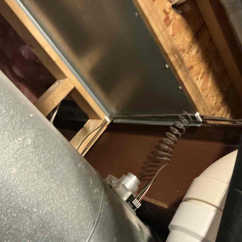 Completed HVAC system estimate for full equipment replacement in residential property. Assessed existing ductwork system in attic space, including metal supply plenum and PVC condensate drainage lines. Documented current system configuration and access points through interior ceiling opening to provide comprehensive replacement proposal for new heating and cooling equipment installation.