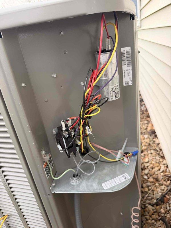 Completed system start-up and commissioning of newly installed HVAC equipment. Performed electrical diagnostics using clamp meter to verify proper amperage draw and system performance, recording 4.34 amps at the outdoor unit. Inspected all electrical connections at the control panel, confirmed proper wire terminations at terminal blocks and relays, and verified all safety controls were functioning correctly.