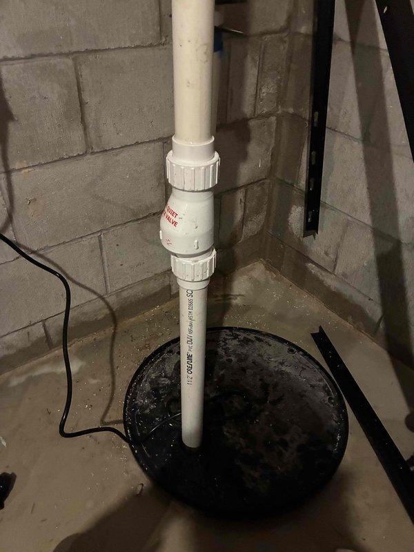 Performed comprehensive inspection and maintenance of residential sump pump system. Verified proper operation of pump mechanism, checked all PVC discharge piping including Schedule 40 connections and couplings for secure fit and proper drainage flow. Confirmed electrical connections were secure and functioning correctly, inspected basin for debris accumulation and water level operation. All components found to be in working order with adequate discharge capacity for basement water management needs.
