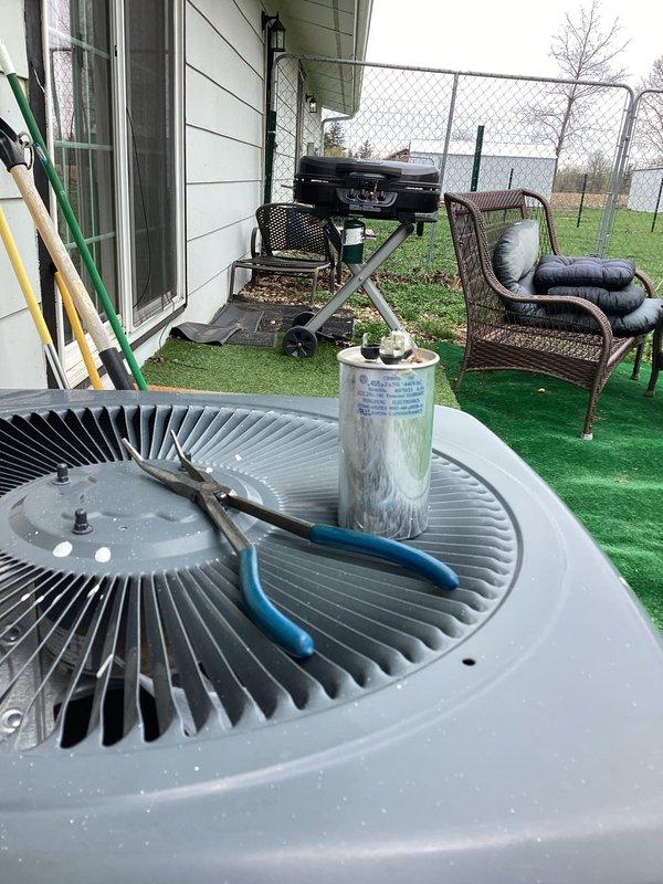 # HVAC Service Report - No Cooling Issue

Responded to a no cooling call on a 10+ year old residential HVAC system. Upon arrival, performed a comprehensive system evaluation of both the indoor furnace unit and outdoor condensing unit. 

Inspected the basement-mounted furnace, noting the condition of the supply ductwork and verifying proper gas line and condensate drainage connections. Proceeded to the outdoor condenser unit where the top grille was removed to access internal components. Examined the condenser fan motor and blade assembly for proper operation. Inspected the refrigerant lines, including the suction and liquid lines, and evaluated the filter drier condition.

Given the age of the system (10+ years), performed diagnostic testing to identify the root cause of the cooling failure. Checked electrical connections, capacitor function, and compressor operation. Assessed refrigerant charge levels and system pressures to determine if refrigerant loss or mechanical failure was cont