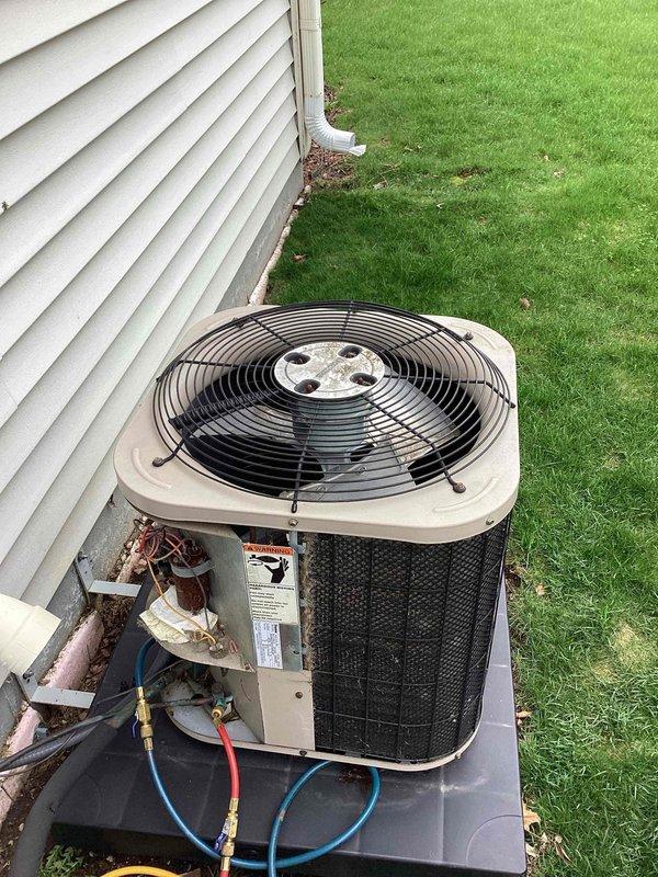 # HVAC Service Report - No Cool Condition

Responded to no cooling complaint on residential air conditioning system over 10 years old. Upon arrival, performed visual inspection of outdoor condensing unit and electrical components. Found heavily corroded dual run capacitor with significant rust deterioration affecting the metal casing and mounting hardware. Capacitor showed extensive oxidation from prolonged environmental exposure, indicating component was well beyond serviceable life.

Connected manifold gauges to service ports and performed system diagnostics. Verified compressor and condenser fan motor operation. Due to severe corrosion on existing capacitor and compromised electrical connections, determined immediate replacement was necessary to restore cooling function and prevent potential system failure.

Disconnected power to unit and safely removed failed capacitor. Cleaned terminal connections and inspected wiring harness for additional damage from corrosion. Installed new dua