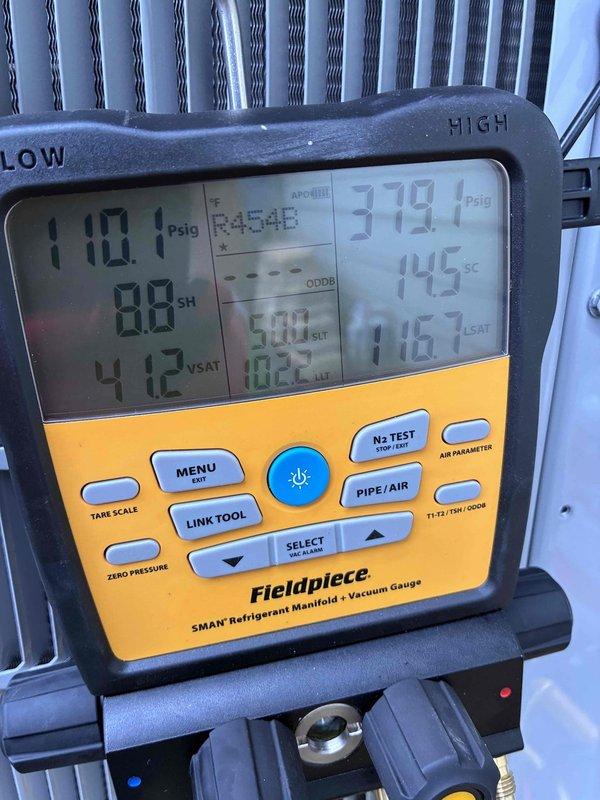 Completed installation and system start-up of residential air conditioning unit. Performed refrigerant charging procedures and verified system pressures using digital manifold gauges, with readings showing 110.1 psig on low side and 379.1 psig on high side, along with superheat of 88°F and subcooling of 145°F. Condenser unit properly positioned on concrete pad with appropriate clearances, refrigerant line sets insulated and routed to building, and all electrical connections completed per manufacturer specifications.