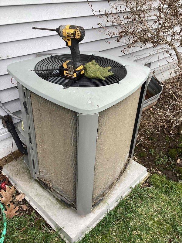# HVAC Service Call - No Cool Condition

Responded to service call for outdoor condensing unit experiencing no cooling condition. Upon arrival, performed visual inspection of equipment exterior, noting unit showed normal wear consistent with age and outdoor exposure. Condenser appeared to be properly positioned on concrete pad with adequate clearance for airflow.

Conducted diagnostic assessment of system components to identify cause of cooling failure. Removed access panels to inspect internal components and electrical connections. Utilized power tools to access secured panels and perform necessary testing procedures. Evaluated fan motor operation, compressor function, and capacitor condition. Checked refrigerant pressures and verified electrical supply to unit.

Identified failed component preventing system operation. Performed necessary repairs to restore cooling function. Verified proper system startup sequence and confirmed compressor engagement. Monitored unit through complete co