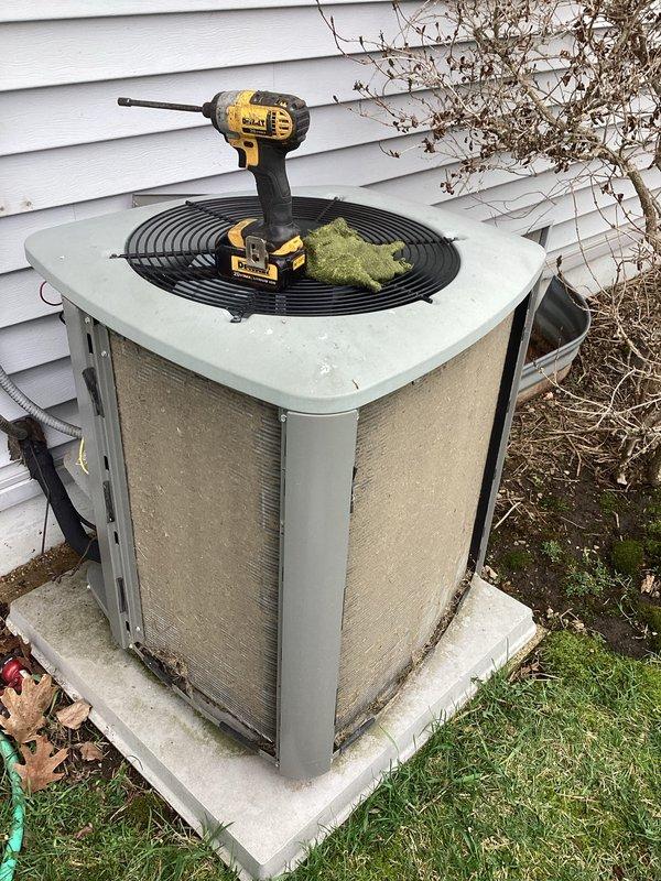 # HVAC Service Call - No Cool Condition

Responded to service call for outdoor condensing unit experiencing no cooling condition. Upon arrival, performed visual inspection of equipment exterior, noting unit showed normal wear consistent with age and outdoor exposure. Condenser appeared to be properly positioned on concrete pad with adequate clearance for airflow.

Conducted diagnostic assessment of system components to identify cause of cooling failure. Removed access panels to inspect internal components and electrical connections. Utilized power tools to access secured panels and perform necessary testing procedures. Evaluated fan motor operation, compressor function, and capacitor condition. Checked refrigerant pressures and verified electrical supply to unit.

Identified failed component preventing system operation. Performed necessary repairs to restore cooling function. Verified proper system startup sequence and confirmed compressor engagement. Monitored unit through complete co