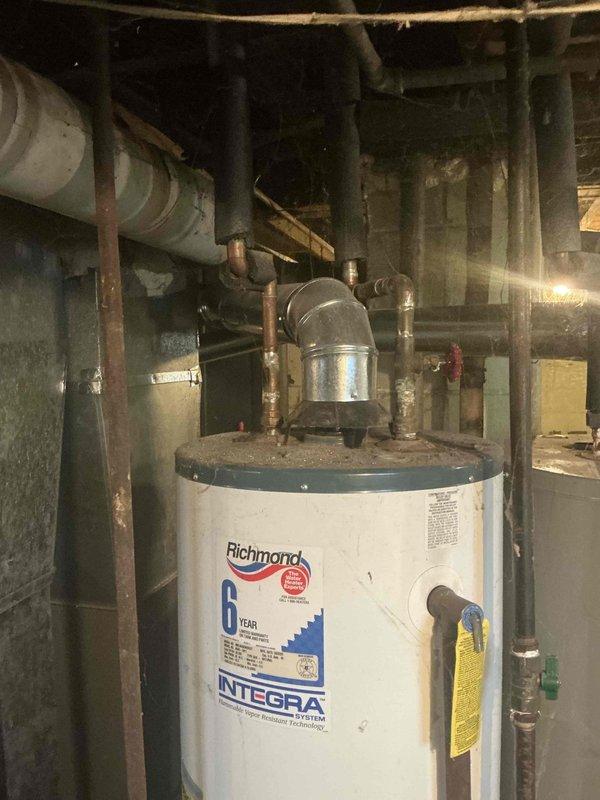 Completed comprehensive HVAC system assessment in basement utility area to provide replacement estimate. Evaluated existing furnace/air handler equipment, ductwork configuration including curved return air sections and cylindrical distribution ducts, and overall system layout for replacement specifications. Documented current equipment conditions, spatial constraints, and mechanical room infrastructure to develop accurate proposal for new HVAC system installation.