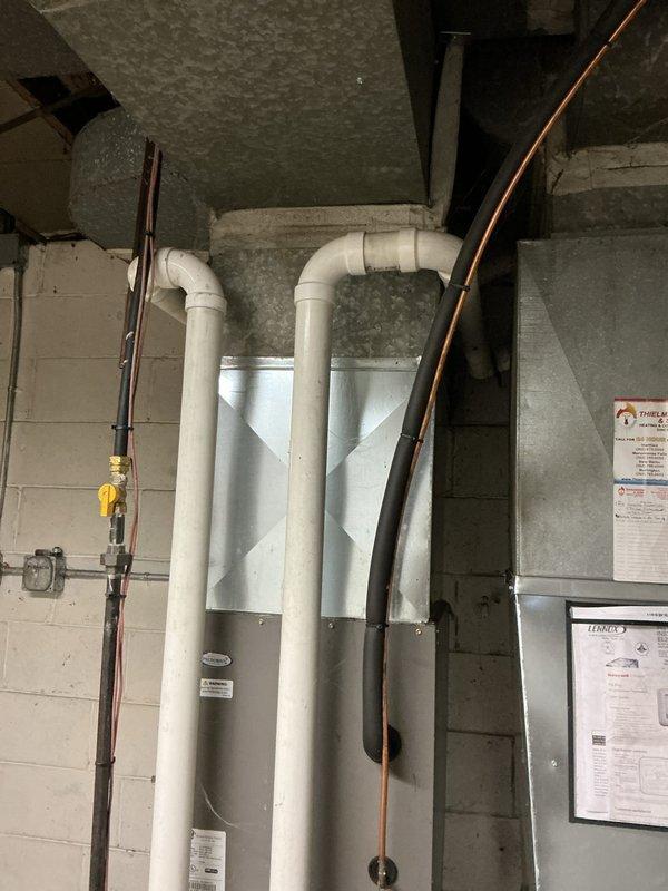 Completed comprehensive tune-up and maintenance inspection on residential Lennox furnace and air handler system. Performed standard seasonal maintenance including filter inspection, burner examination, heat exchanger evaluation, blower motor lubrication, and verification of all safety controls and limit switches. Inspected PVC venting system, refrigerant line connections, gas line integrity with yellow shut-off valve, and confirmed proper drainage. All components found operating within manufacturer specifications with no immediate repairs required.