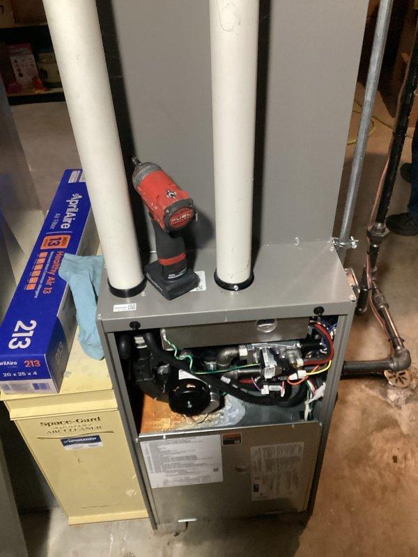 Performed comprehensive tune-up and safety inspection on residential gas furnace system. Accessed internal components, verified proper operation of blower motor and gas valve assembly, inspected electrical connections and wiring harnesses, checked intake and exhaust venting system, and replaced air filter to ensure optimal system performance and efficiency.
