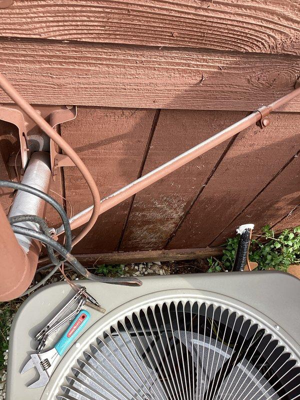 Completed installation of new air conditioning condenser unit and evaporator coil at residential property. Installed outdoor condensing unit on concrete pad with proper clearances, ran and insulated refrigerant line set along exterior wall, connected electrical components, and charged system with refrigerant to manufacturer specifications. System tested and verified operational with proper airflow and cooling performance.