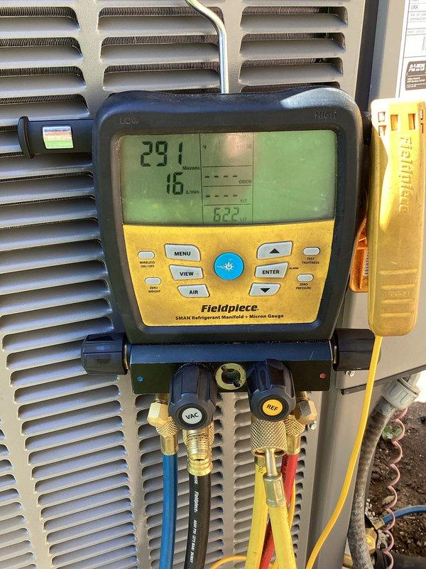 Completed installation of new air conditioning condenser unit and evaporator coil system. Performed evacuation and vacuum testing to verify system integrity, achieving proper micron levels as confirmed by digital manifold gauge readings. Charged system with refrigerant to manufacturer specifications using manifold gauge set, verified proper system pressures, and conducted final operational testing to ensure optimal performance of the new HVAC equipment.