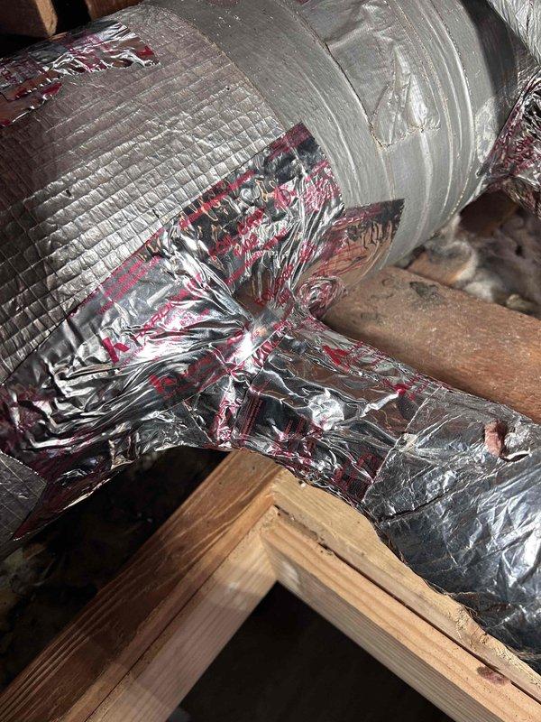 Installed flexible HVAC ductwork in attic space, including proper connection to copper pipe collar with metallic foil tape sealing at junction points. Routed insulated flex duct through structural framing members to ensure adequate airflow distribution throughout the system.