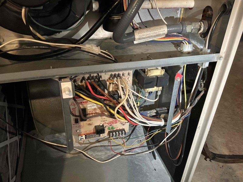 Conducted comprehensive assessment of residential HVAC system located in basement to provide replacement estimate for air conditioning unit experiencing refrigerant leaks. Inspected existing AC system control board, electrical connections, and internal components, documenting condition of wiring harness, relays, and blower assembly showing signs of age and operational wear. Also evaluated natural gas furnace for potential replacement estimate as requested, examining overall system configuration and installation environment within basement utility area.