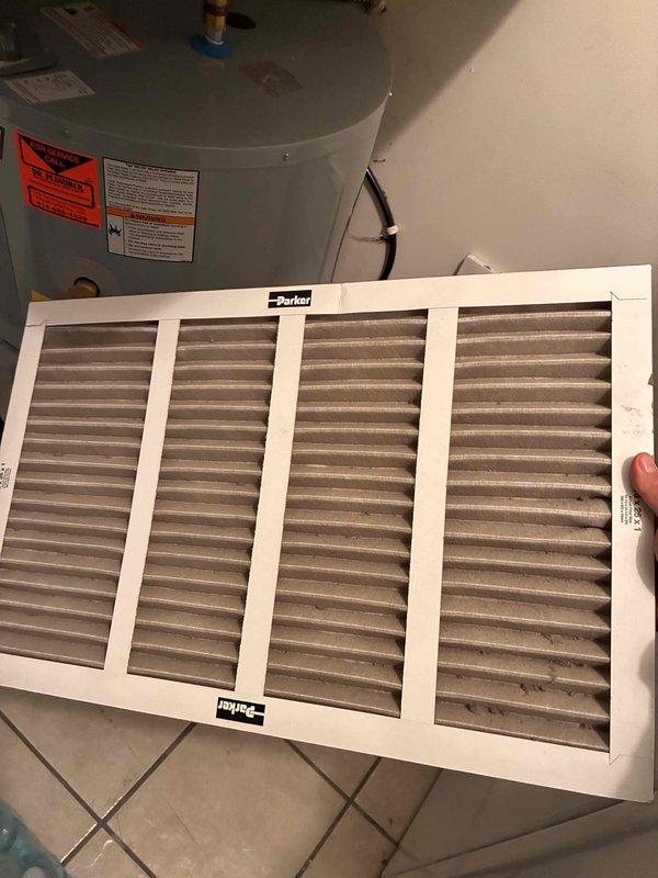 Completed preventative maintenance tune-up on residential HVAC system. Inspected and photographed air filter showing moderate dust accumulation on pleated media; filter remains serviceable but approaching replacement interval. Accessed condensing unit electrical compartment and inspected capacitor, contactor, and associated wiring connections; all components operating within normal parameters with secure wire terminations and no signs of electrical failure or overheating.