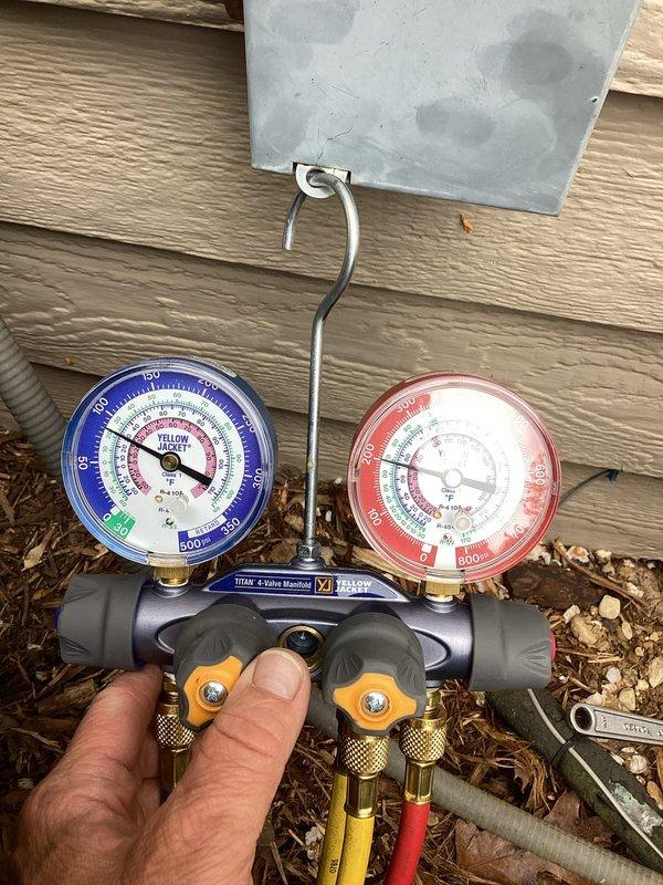 Performed complete tune-up and diagnostic evaluation on residential air conditioning system. Connected manifold gauges to verify refrigerant pressures and system performance, inspected condenser unit operation, and ensured all electrical connections and components were functioning within manufacturer specifications. All system parameters tested normal with unit operating efficiently.