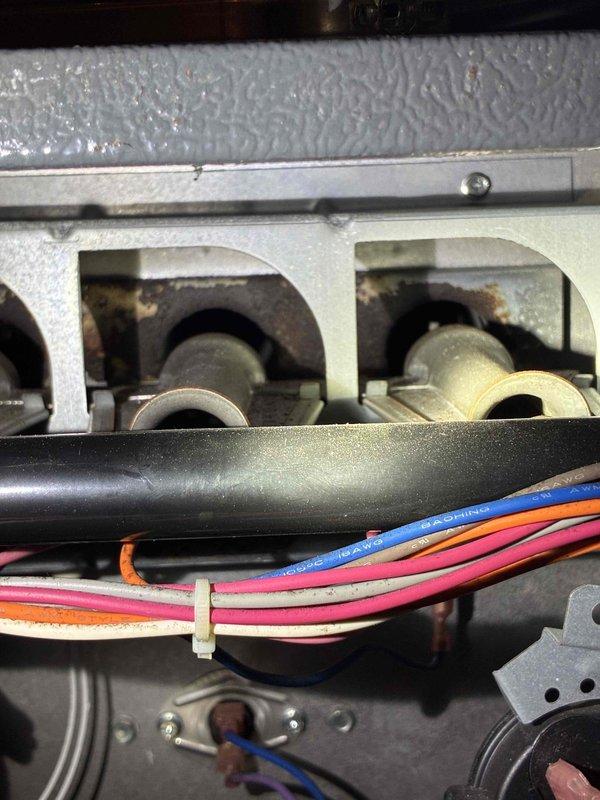 # HVAC Service - No Heat Call

Responded to no heat call on residential HVAC system less than 10 years old. Upon inspection, found unit not operating due to electrical control issue. Accessed interior mechanical compartment and inspected wiring connections, blower assembly, and control board components. Identified loose wire connections at terminal block affecting system operation. Secured all electrical connections, verified proper wire routing and strain relief with cable ties, and tested system controls. Cycled unit through complete heating operation, confirmed proper ignition sequence, verified blower motor operation, and ensured adequate airflow through heat exchanger. System restored to normal heating operation with all safety controls functioning properly.