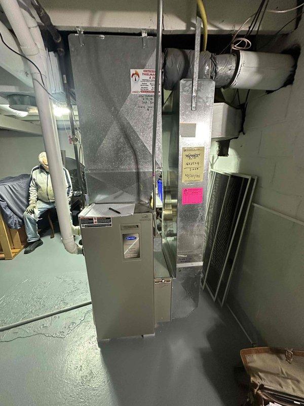 Conducted comprehensive HVAC system assessment in basement utility area to provide replacement estimate. Evaluated existing Carrier furnace/air handler unit, associated galvanized metal ductwork system, and electrical panel configuration to determine equipment specifications and installation requirements. Documented current system layout including rectangular trunk lines, branch ducts, and insulated duct sections to plan for new equipment integration with existing infrastructure while ensuring proper sizing and compatibility for optimal system performance.