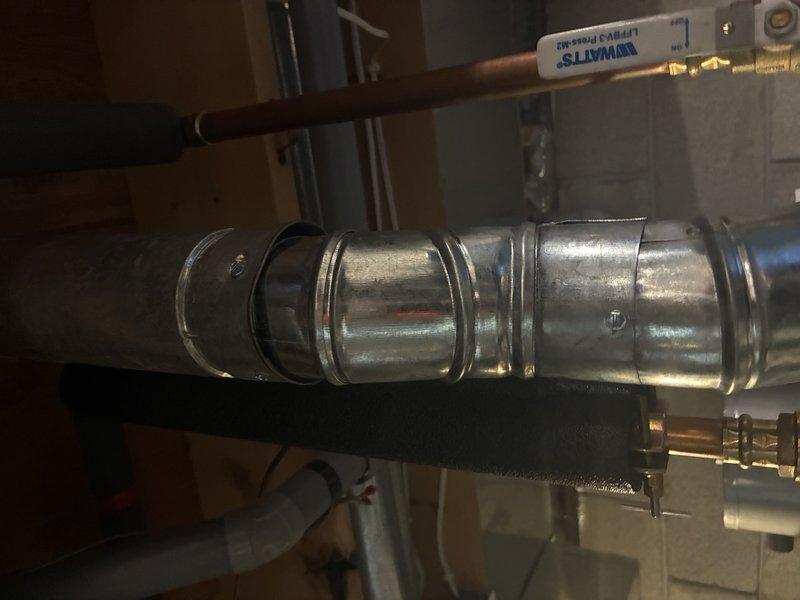 Completed installation of new water service line and associated plumbing connections for residential property. Installed exterior water service pipe penetration through building wall with proper sealing and weatherproofing, ran copper supply piping through basement mechanical area with secure mounting and appropriate clearances from HVAC ductwork, and ensured all connections meet code requirements for potable water distribution.