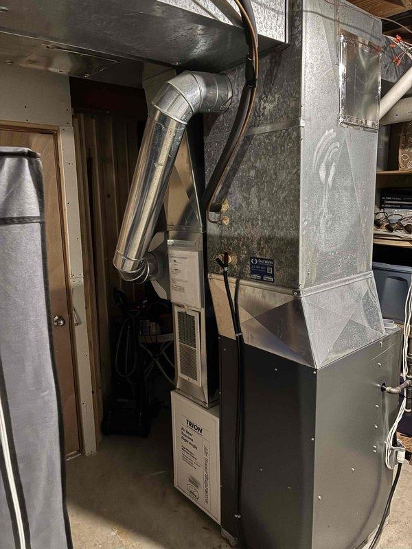 Completed on-site estimate for full HVAC system replacement including 30+ year old air conditioning unit and existing gas furnace. Assessed current equipment condition, documented outdoor condensing unit with weathered cabinet and overgrown surroundings, and evaluated basement-installed furnace with connected ductwork and vertical venting system. Provided replacement options and recommendations for updated, energy-efficient equipment to improve system performance and reliability.