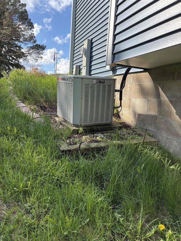 Completed on-site estimate for full HVAC system replacement including 30+ year old air conditioning unit and existing gas furnace. Assessed current equipment condition, documented outdoor condensing unit with weathered cabinet and overgrown surroundings, and evaluated basement-installed furnace with connected ductwork and vertical venting system. Provided replacement options and recommendations for updated, energy-efficient equipment to improve system performance and reliability.