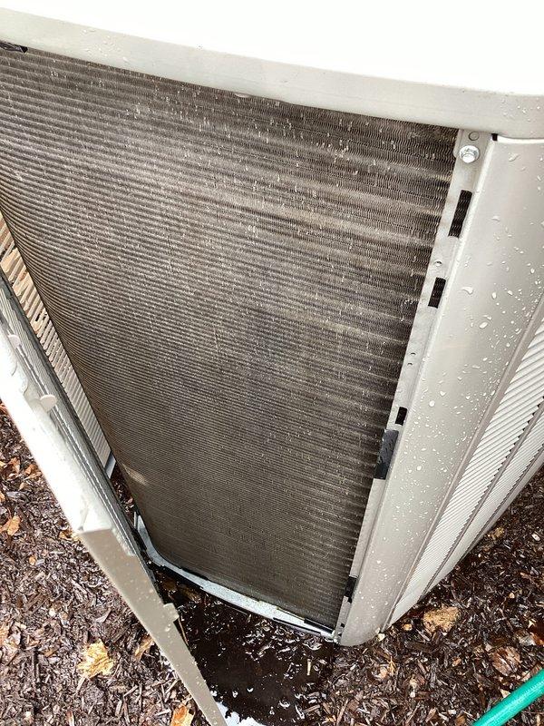Performed comprehensive tune-up on outdoor heat pump condenser unit. Upon arrival, found heat exchanger coils heavily contaminated with dirt, debris, and biological growth causing significant airflow restriction. Removed access panels to expose internal components, revealing substantial accumulation of dust and debris on interior surfaces and coil fins. Thoroughly cleaned condenser coils using appropriate cleaning methods to restore proper heat transfer efficiency. Cleared all debris from unit interior and surrounding area. Inspected copper refrigerant lines and insulation for damage. Verified proper operation of all mechanical and electrical components following cleaning procedures. Unit returned to normal operating condition with improved airflow and heat exchange capacity.