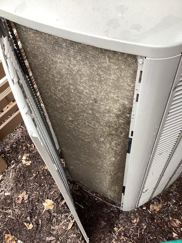 Performed comprehensive tune-up on outdoor heat pump condenser unit. Upon arrival, found heat exchanger coils heavily contaminated with dirt, debris, and biological growth causing significant airflow restriction. Removed access panels to expose internal components, revealing substantial accumulation of dust and debris on interior surfaces and coil fins. Thoroughly cleaned condenser coils using appropriate cleaning methods to restore proper heat transfer efficiency. Cleared all debris from unit interior and surrounding area. Inspected copper refrigerant lines and insulation for damage. Verified proper operation of all mechanical and electrical components following cleaning procedures. Unit returned to normal operating condition with improved airflow and heat exchange capacity.