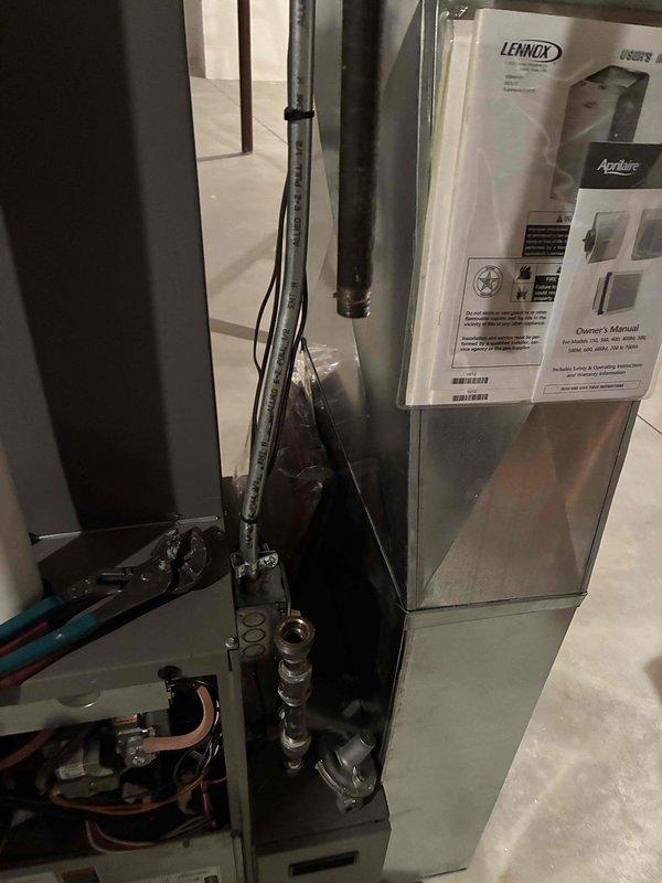 Responded to gas leak service call and performed thorough inspection of HVAC system and gas connections. Located faulty brass pipe fitting with worn threading and surface deterioration that was compromising the gas line seal. Removed defective connector and replaced with new properly-rated brass fitting, ensuring all threads were clean and connections were torqued to manufacturer specifications. Conducted leak test using approved detection methods to verify complete seal integrity throughout the gas supply system. Inspected Lennox furnace unit and associated piping connections for any additional concerns. All gas lines tested and confirmed leak-free with system restored to safe operating condition.