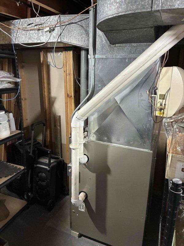 Completed estimate for replacement of existing gas furnace and air conditioning system in basement location. Current equipment includes 60,000 BTU furnace from 2006 and 2-ton air conditioner requiring replacement. Assessed existing ductwork configuration, including galvanized metal trunk lines and PVC condensate drainage system. Evaluated installation area with exposed framing and utility access for equipment removal and new system installation. Documented existing HVAC setup and provided replacement options with available financing programs.