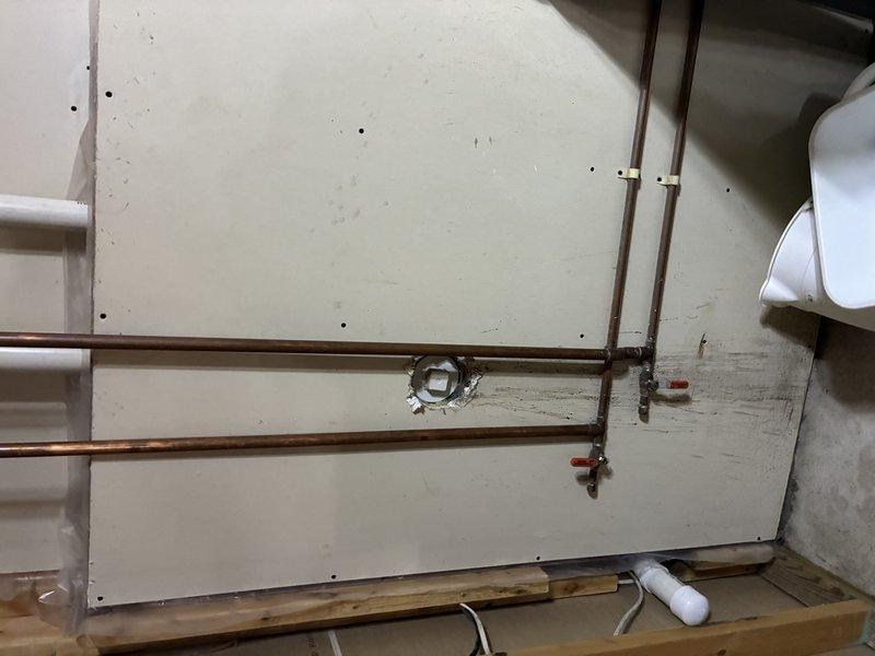 Conducted site assessment for washer and dryer installation requiring gas line, hot water supply valve, and drain connections. Evaluated existing mechanical space with exposed framing, identified routing paths for copper supply lines and PVC drainage, and documented current HVAC ductwork and utility infrastructure to provide accurate estimate for required plumbing modifications.