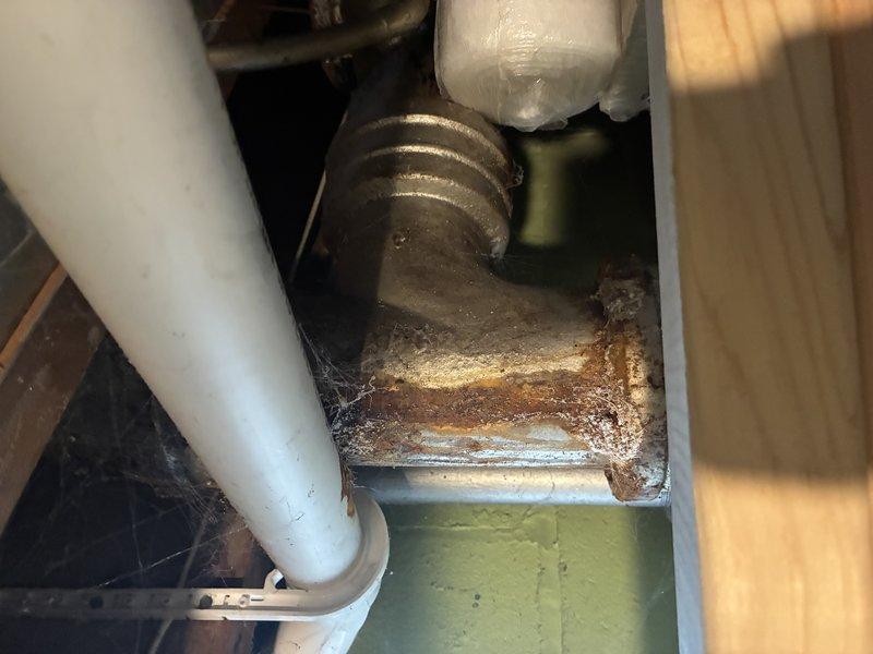 Completed complimentary membership plumbing inspection during requested afternoon timeframe. Conducted thorough examination of accessible plumbing systems including under-sink components and bathroom fixtures. Documented significant corrosion on metal mounting bracket in cabinet area, indicating prolonged moisture exposure that may require future attention. All visible bathroom fixtures including toilet and pedestal sink found in good working condition with no active leaks detected at time of inspection.