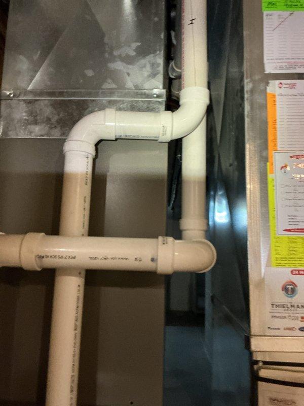 Completed furnace and air conditioning tune-up for new homeowner requesting equipment evaluation. Performed comprehensive inspection of HVAC system including furnace/air handler unit and associated condensate drainage system with PVC piping configuration. All equipment found to be in proper working order with clean installation and adequate drainage lines functioning correctly.