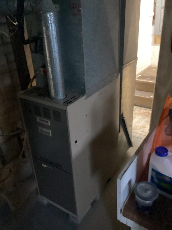 Responded to no-heat call for 1998 gas furnace. Upon arrival, performed diagnostic inspection of aging forced-air heating system located in basement utility area. Assessed furnace operation, verified gas supply, checked electrical connections, and inspected heat exchanger and burner assembly for signs of failure or safety concerns. Given the age of the unit at 26+ years old, evaluated whether system could be temporarily restored to operation or if replacement was necessary. Documented equipment condition with photos and provided findings to customer who had already scheduled replacement estimate.