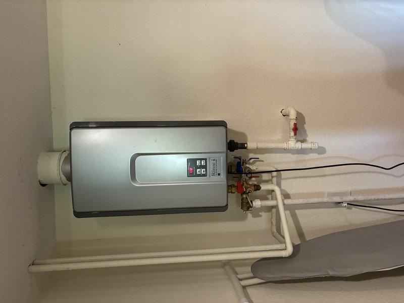 Responded to diagnostic call for Rinnai RL75 tankless water heater displaying code 10 error indicating air flow obstruction or overheating condition. Performed troubleshooting procedures including fan assembly cleaning and exhaust vent system purging to remove potential blockages. Unit continued to generate fault code after corrective attempts, indicating possible internal component failure such as fan motor, air pressure sensor, or heat exchanger issue requiring further repair or unit replacement.