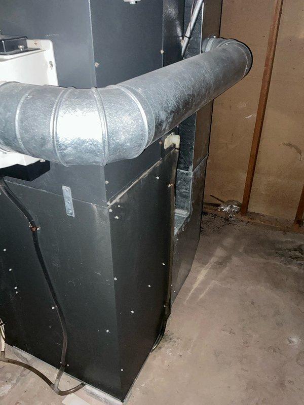 Conducted comprehensive assessment of existing HVAC system in basement utility area for equipment replacement estimate. Evaluated current furnace, air conditioning unit, and humidifier system, all of which are functional but have reached end of service life. Documented existing air handler installation, ductwork connections, and mechanical room conditions through photographic documentation. Provided replacement recommendations for complete system upgrade including new furnace, AC unit, and humidifier to improve efficiency and reliability.