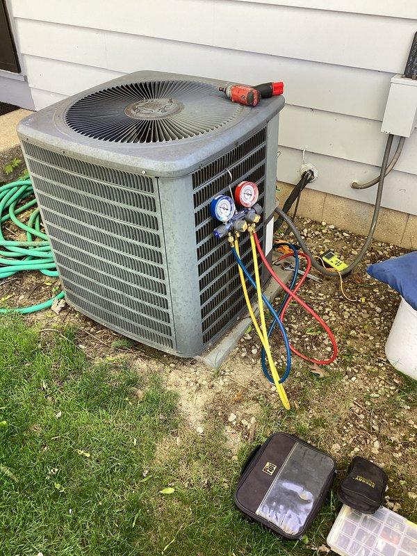 Completed prepaid membership cooling maintenance visit on residential air conditioning system. Performed standard seasonal inspection of outdoor condenser unit, including visual assessment of cabinet condition and component integrity. Connected manifold gauge set to measure refrigerant pressures and verify system charge levels. Inspected electrical components including run capacitor and associated wiring connections, confirming proper terminal connections and component functionality. All system parameters found operating within normal specifications.