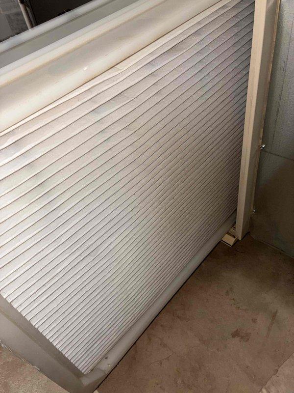 Completed routine HVAC tune-up and system inspection. Examined and documented the condition of the air filtration system, noting pleated filter with dust accumulation between ridges. Inspected air handler unit with ribbed coil surface, confirming proper installation and overall clean, well-maintained condition of components.