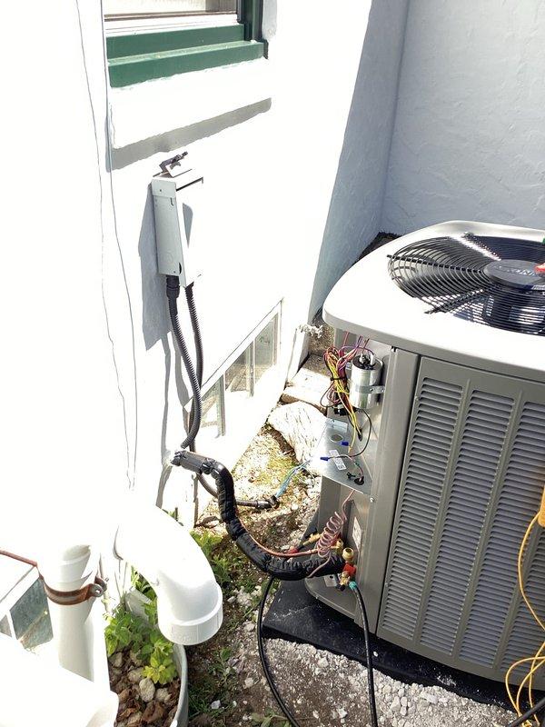 Completed installation of new 3-ton air conditioning system with matching B-width evaporator coil. Installed outdoor condensing unit on concrete pad with proper refrigerant line connections, electrical wiring, and condensate drainage via PVC. Routed copper refrigerant lines and electrical conduit along exterior wall with appropriate insulation and weather protection. System tested and operational upon completion.
