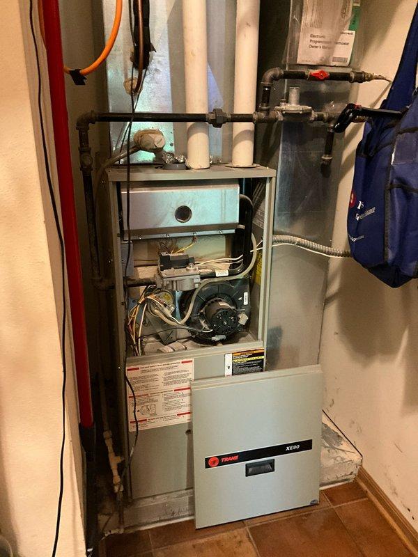 Conducted comprehensive on-site evaluation for complete HVAC system replacement at residential property. Assessed existing Trane XV80 furnace installation in utility area and outdoor condensing unit to provide estimate for full system upgrade including furnace, air conditioning equipment, and potential ductless mini-split options for enhanced climate control flexibility.