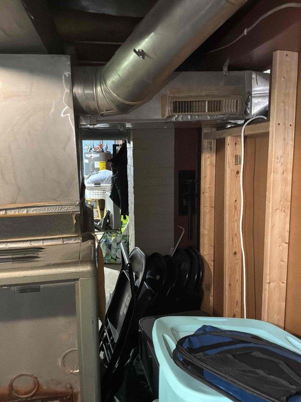 Conducted on-site assessment of existing gas furnace located in basement for replacement estimate and evaluated home for new air conditioning system installation. Documented current equipment configuration, ductwork routing, and available space for new HVAC components, noting that existing furnace is currently operational.