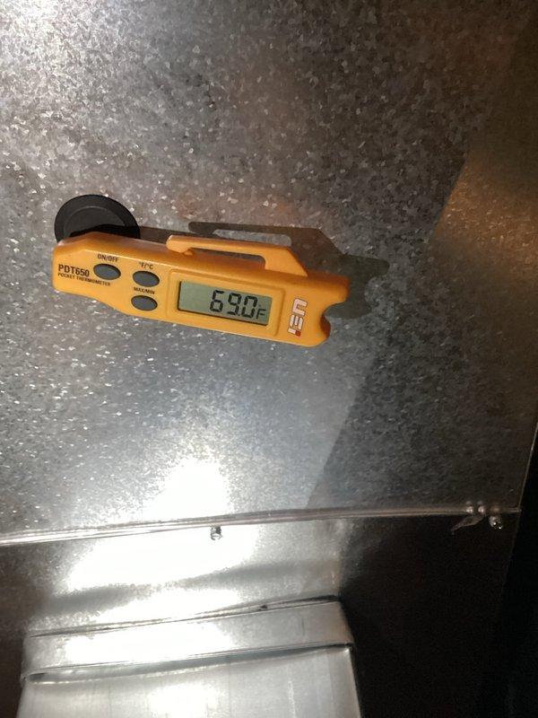 Completed AC spring start-up service with system diagnostics and temperature verification. Supply air temperature measured at 53.3°F and return air at 69.0°F, confirming proper system operation and adequate temperature differential for cooling mode. All equipment functioning within normal parameters.