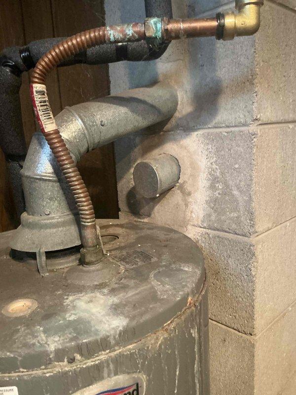 Responded to emergency call for flooded basement affecting HVAC equipment. Conducted on-site assessment and documented existing water heater and furnace conditions for replacement estimate, noting significant water damage, mineral deposits, and aging infrastructure including corroded plumbing connections and compromised sump pump system.
