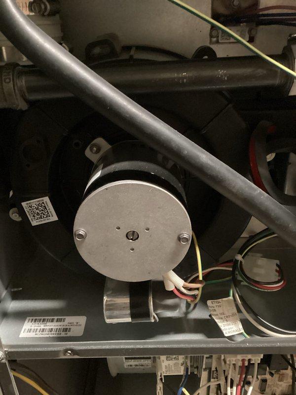 Responded to service call for furnace noise complaint. Inspected internal components and blower assembly. Documented equipment model ML260UH070AV3RB with photos of motor assembly, piping connections, and component identification labels for warranty records.